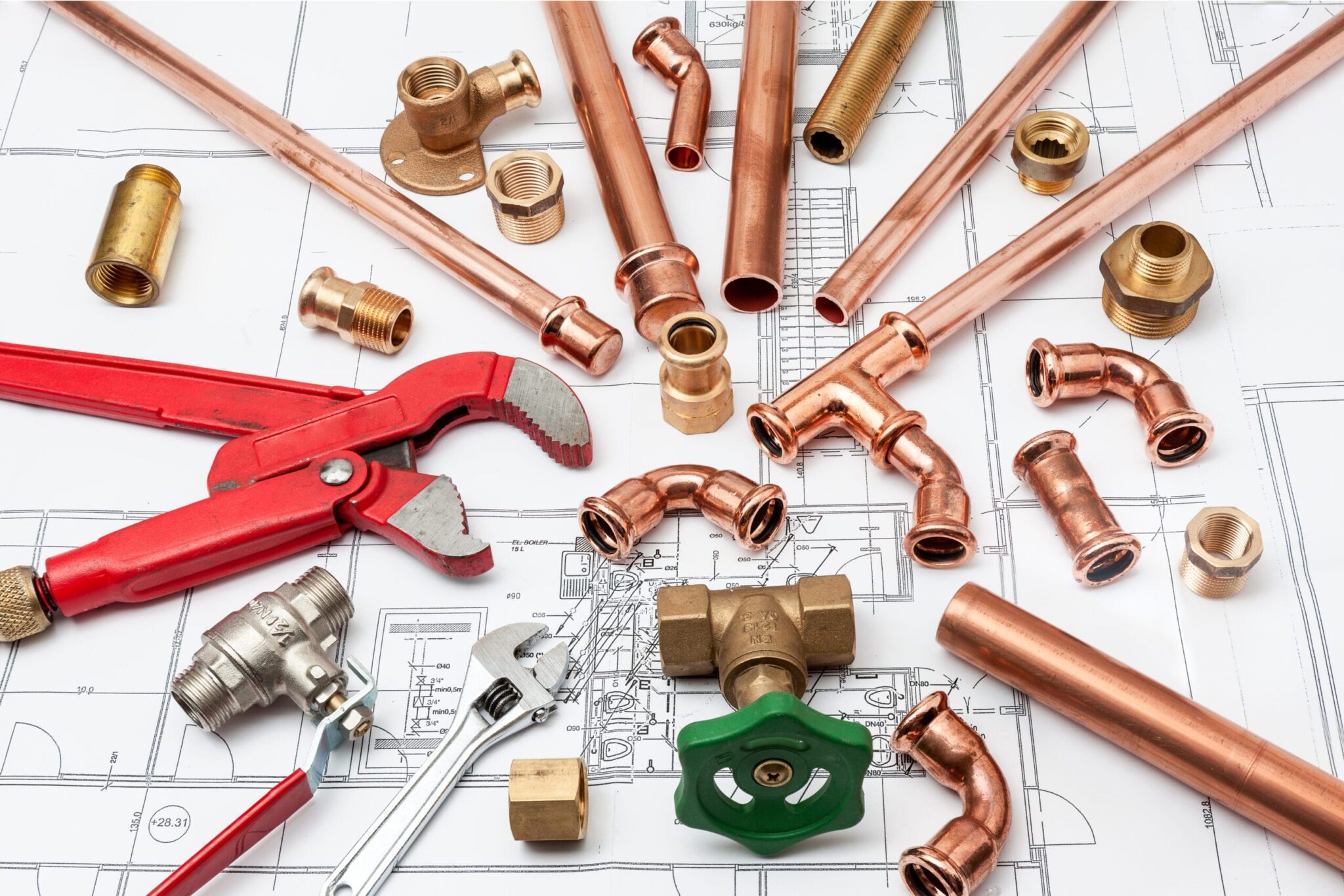 Copper pipes, fittings, valves, and plumbing tools in Bloomington